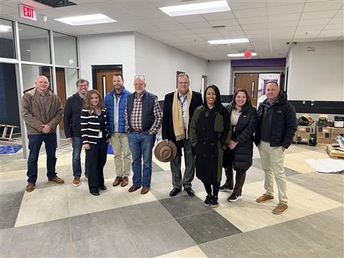 BOE members, others, in front foyer about to take tour